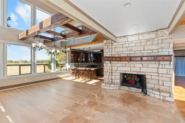a view of livingroom with fireplace and window