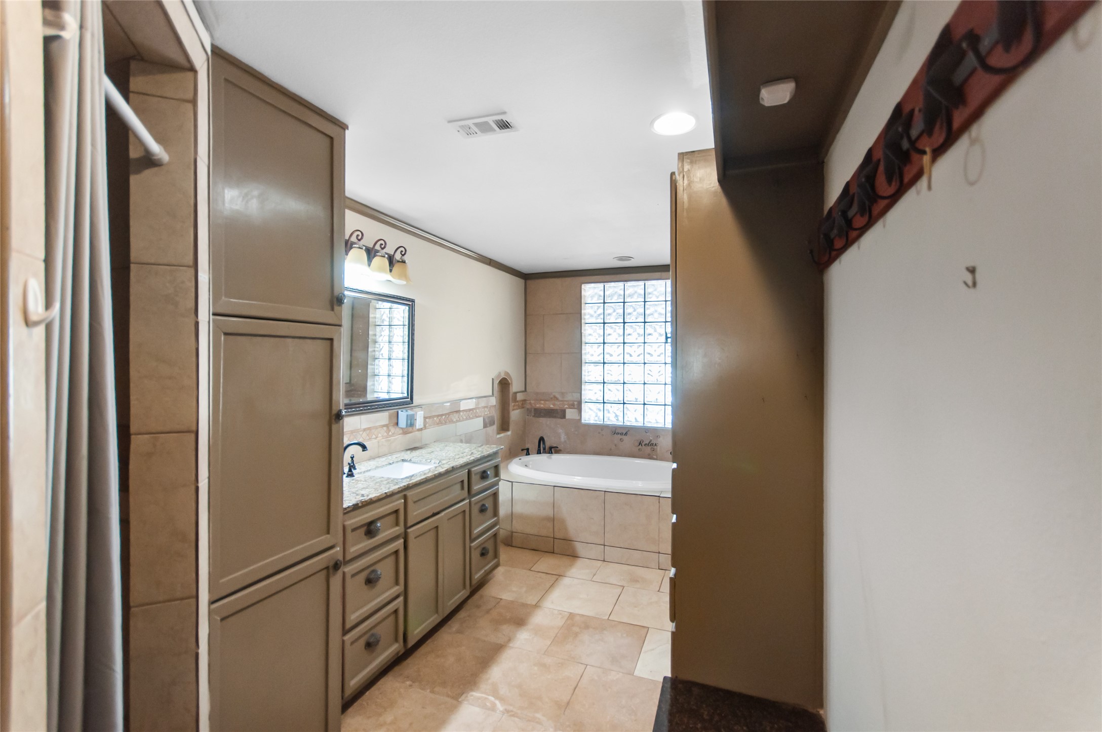 6588 Starks Road Mason, TX 76856 - Photo 19 of 40 a kitchen with stainless steel appliances granite countertop a refrigerator and a sink