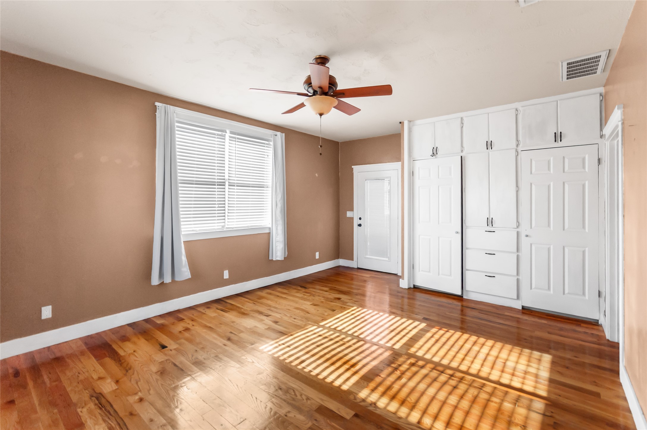 6588 Starks Road Mason, TX 76856 - Photo 35 of 40 a view of an empty room with window and wooden floor