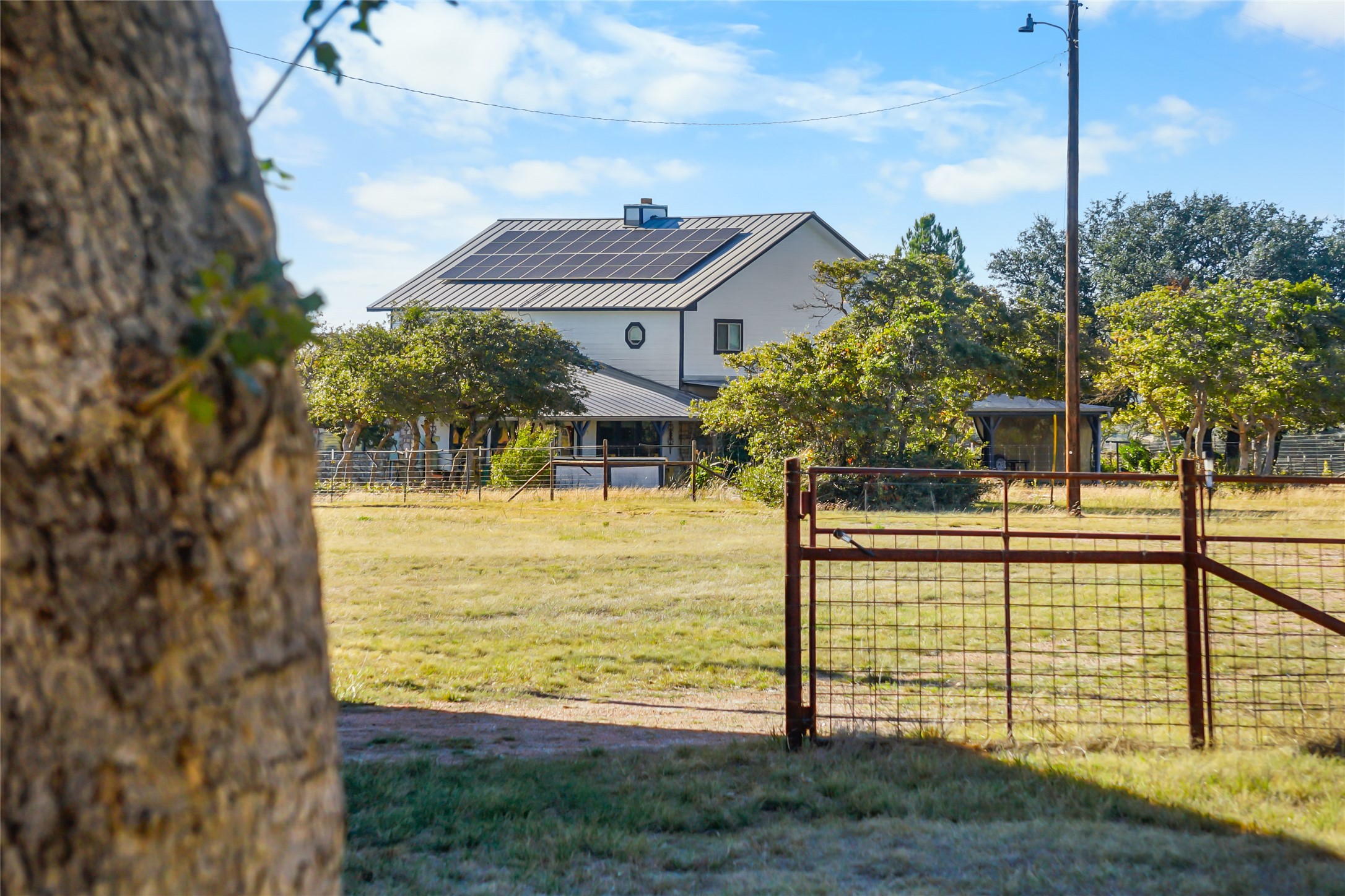 6588 Starks Road Mason, TX 76856 - Photo 4 of 40 a view of a swimming pool with a lawn chairs under an umbrella