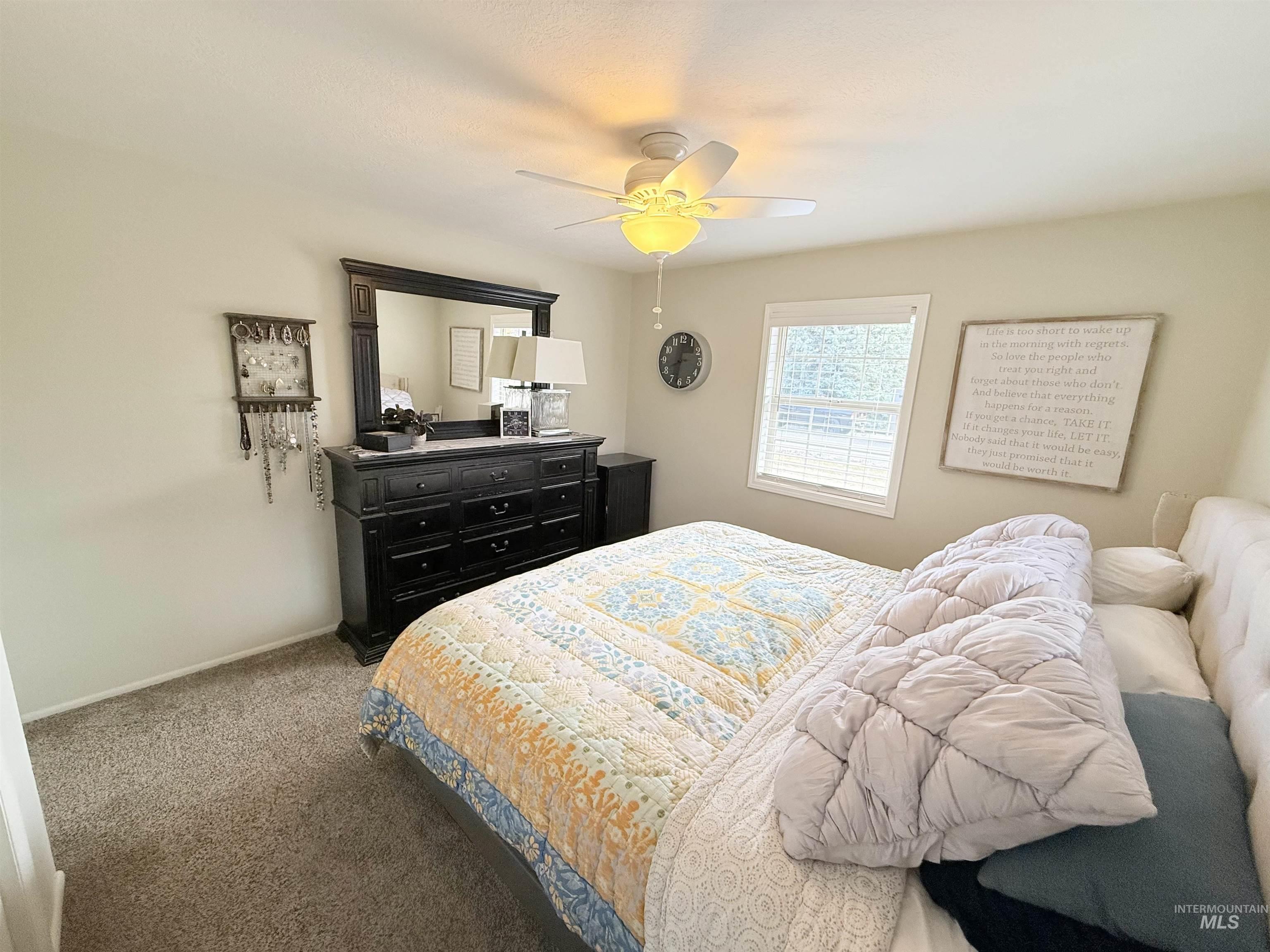 624 20th Street Rupert, ID 83350 - Photo 12 of 31 Bedroom featuring dark colored carpet and ceiling fan