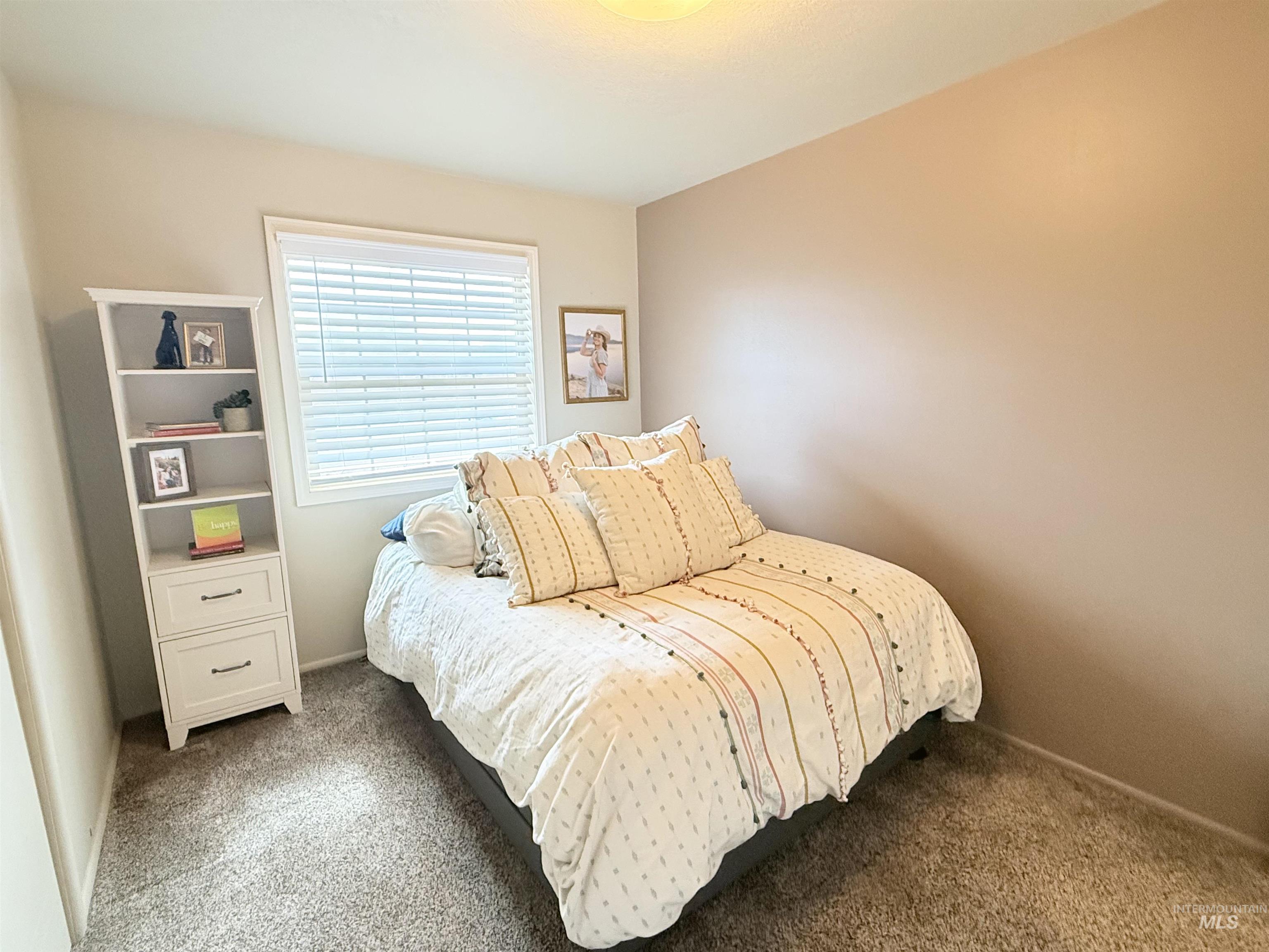 624 20th Street Rupert, ID 83350 - Photo 15 of 31 Bedroom featuring dark carpet and baseboards