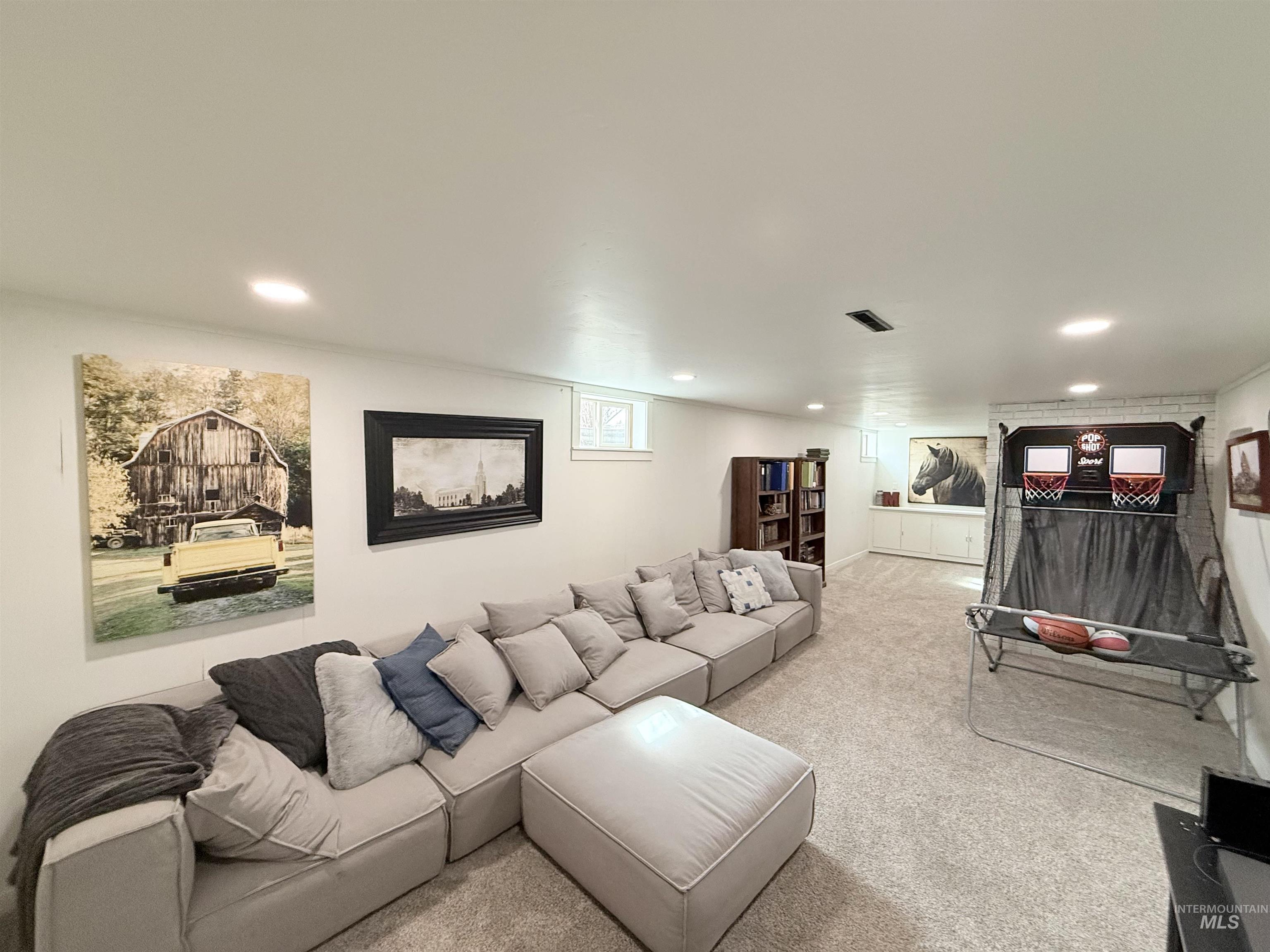 624 20th Street Rupert, ID 83350 - Photo 21 of 31 Living room with light colored carpet and recessed lighting