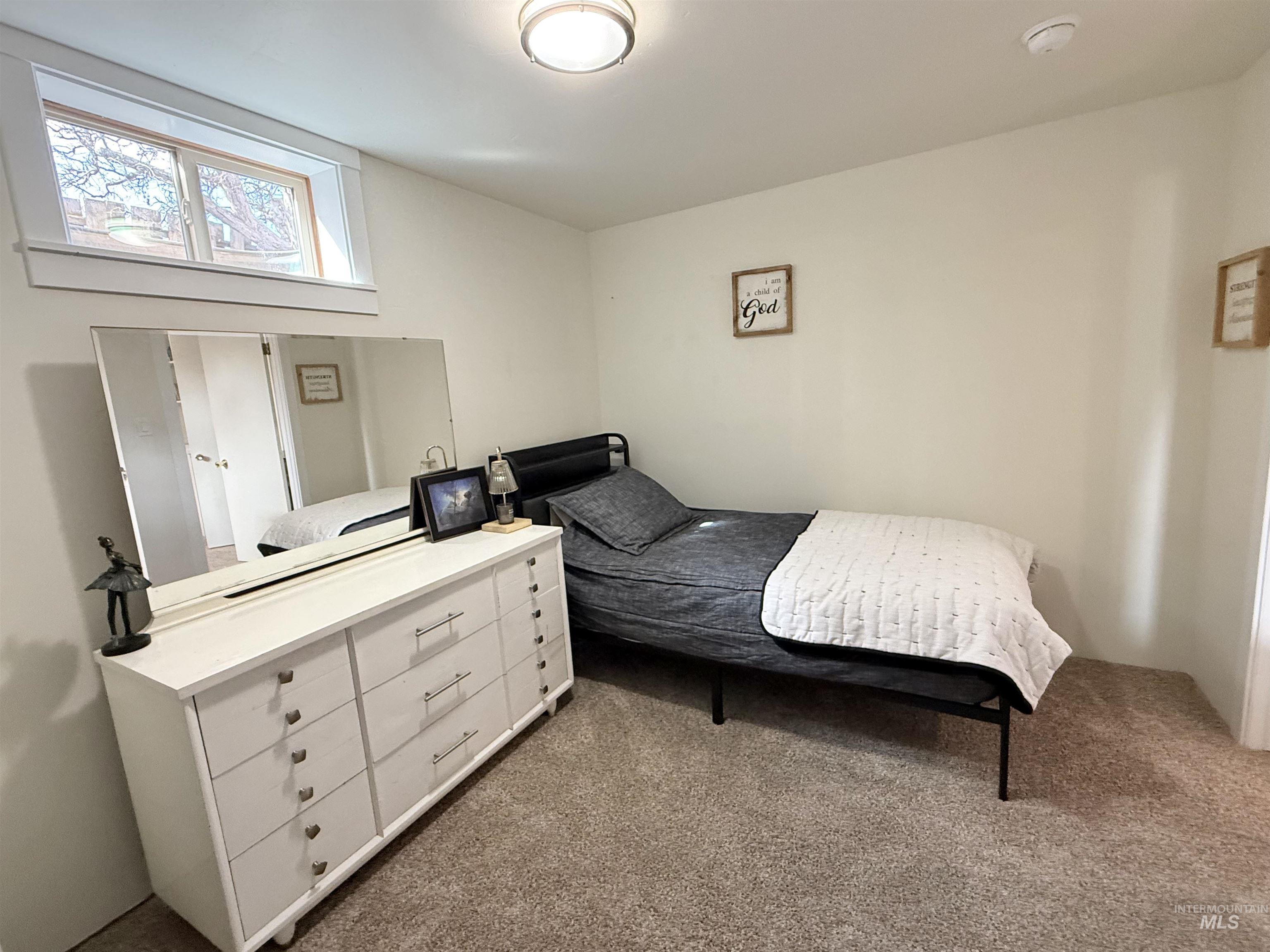 624 20th Street Rupert, ID 83350 - Photo 25 of 31 Bedroom featuring dark carpet