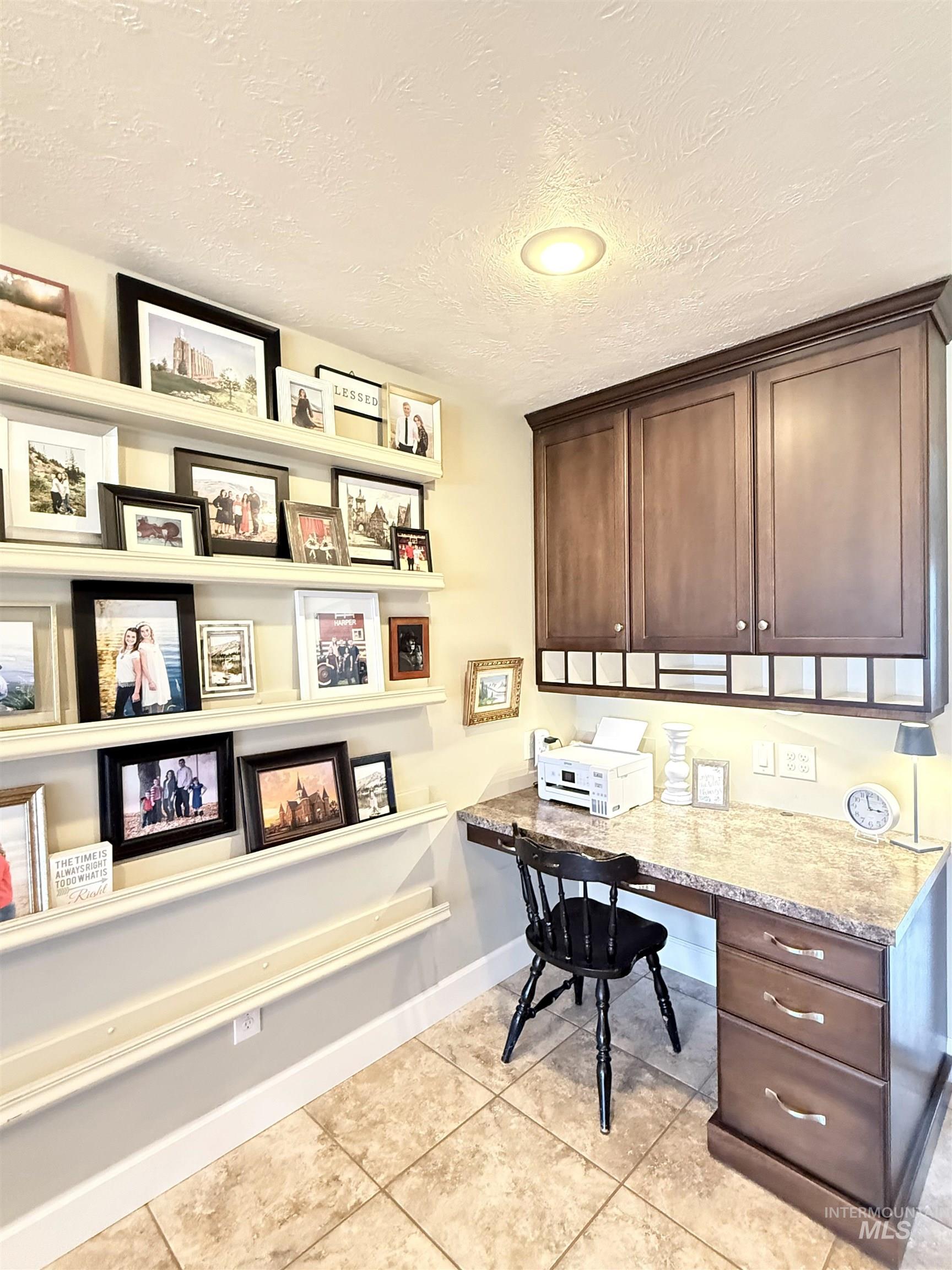 624 20th Street Rupert, ID 83350 - Photo 9 of 31 Office area featuring built in study area and a textured ceiling