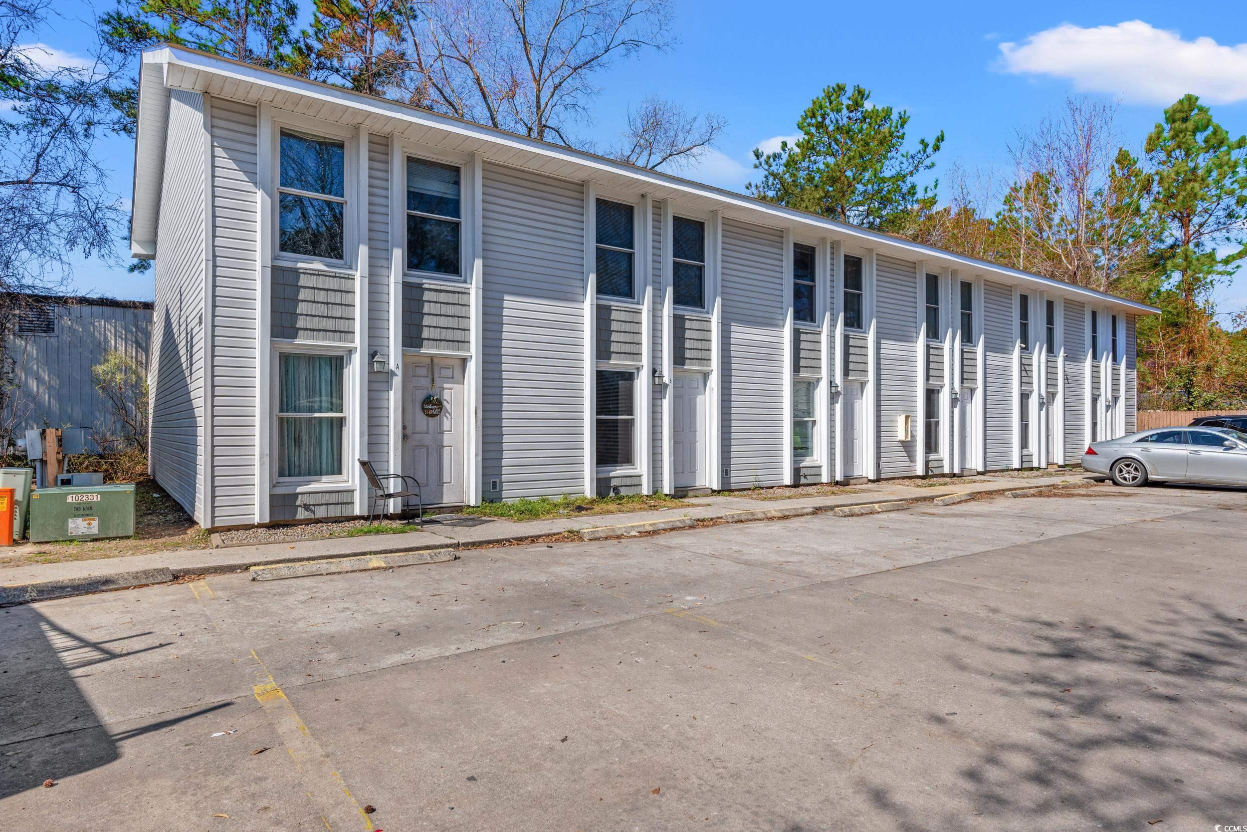 3458 Macklen Road Myrtle Beach, SC 29588 - Photo 2 of 30 View of building exterior featuring uncovered parking