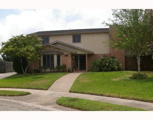 6021 Pinehurst Drive Corpus Christi, TX 78413 - Photo 1 of 1 a front view of a house with a garden