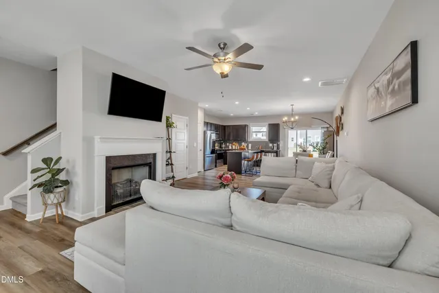 a living room with fireplace furniture and a flat screen tv