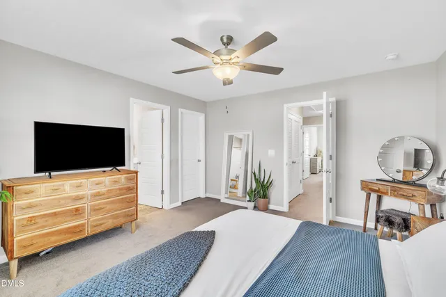 a bathroom with a toilet a sink and a mirror