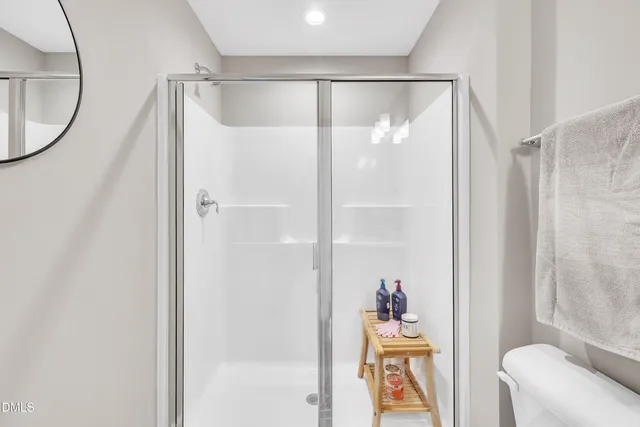 a bedroom with furniture and a flat screen tv