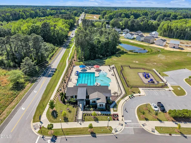a view of a swimming pool with a yard