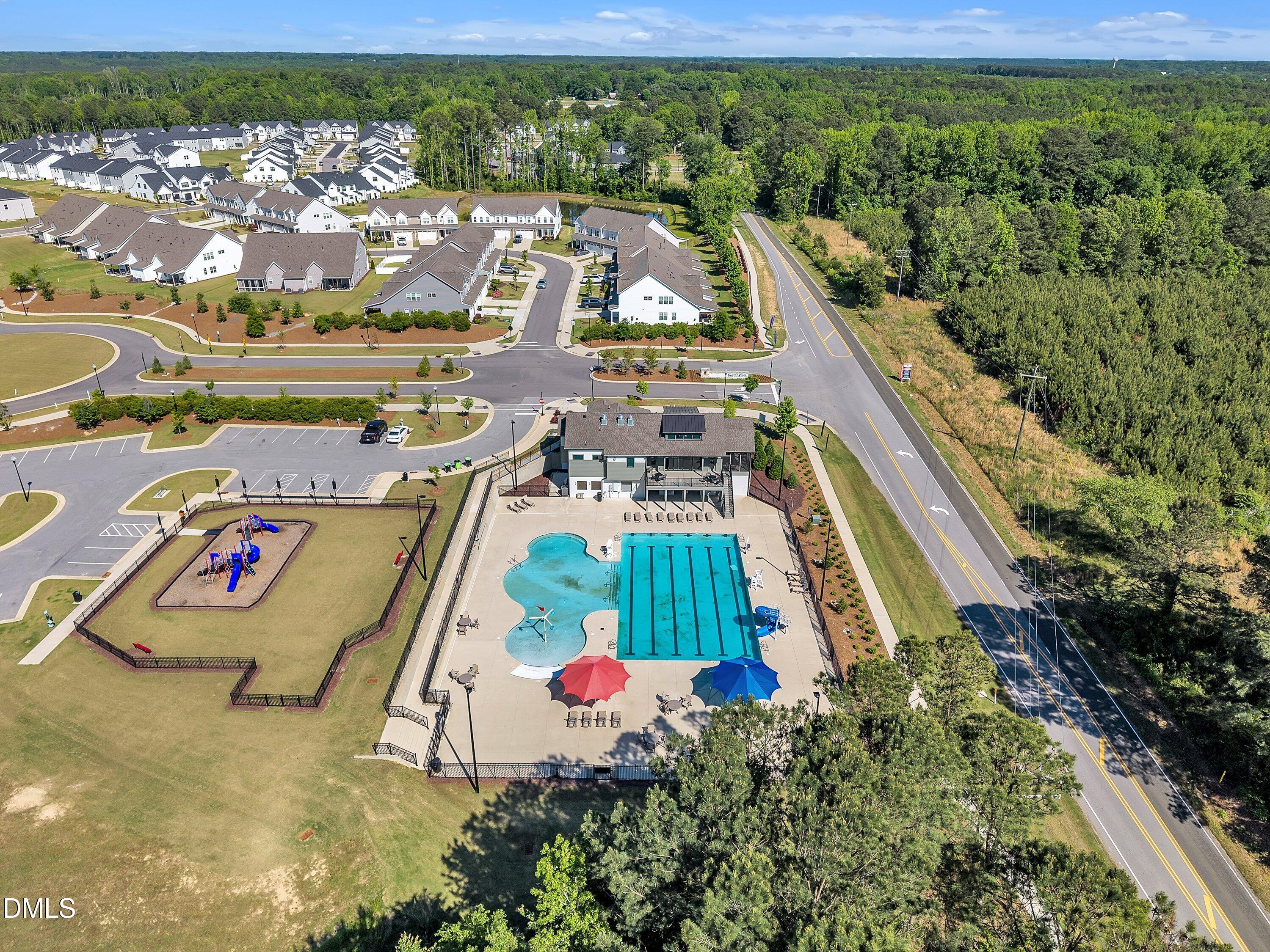 743 Hadstock Path Zebulon, NC 27597 - Photo 38 of 39 a view of a swimming pool with a yard