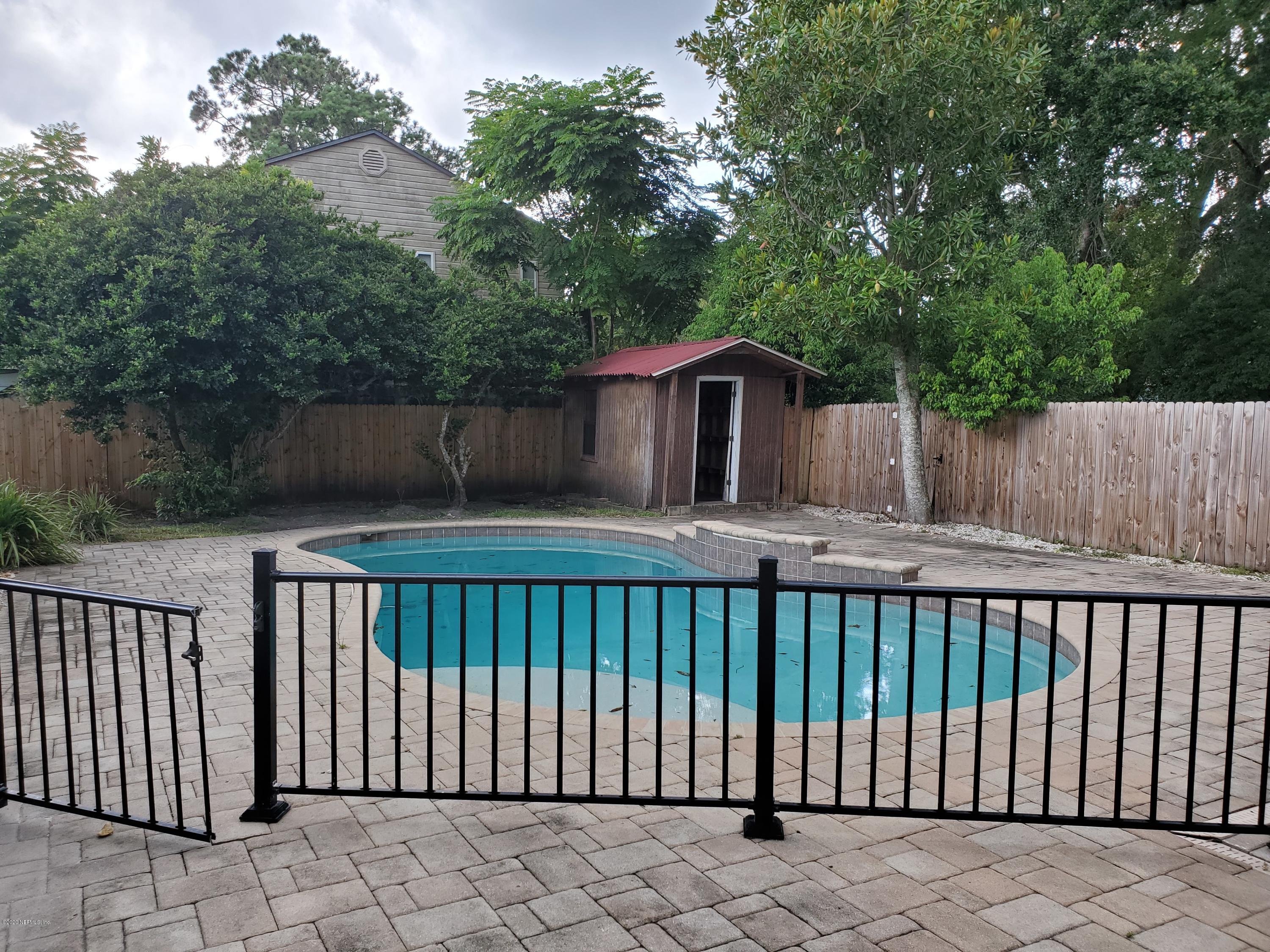 2544 Sam Road Jacksonville, FL 32216 - Photo 36 of 39 a view of a wooden roof deck