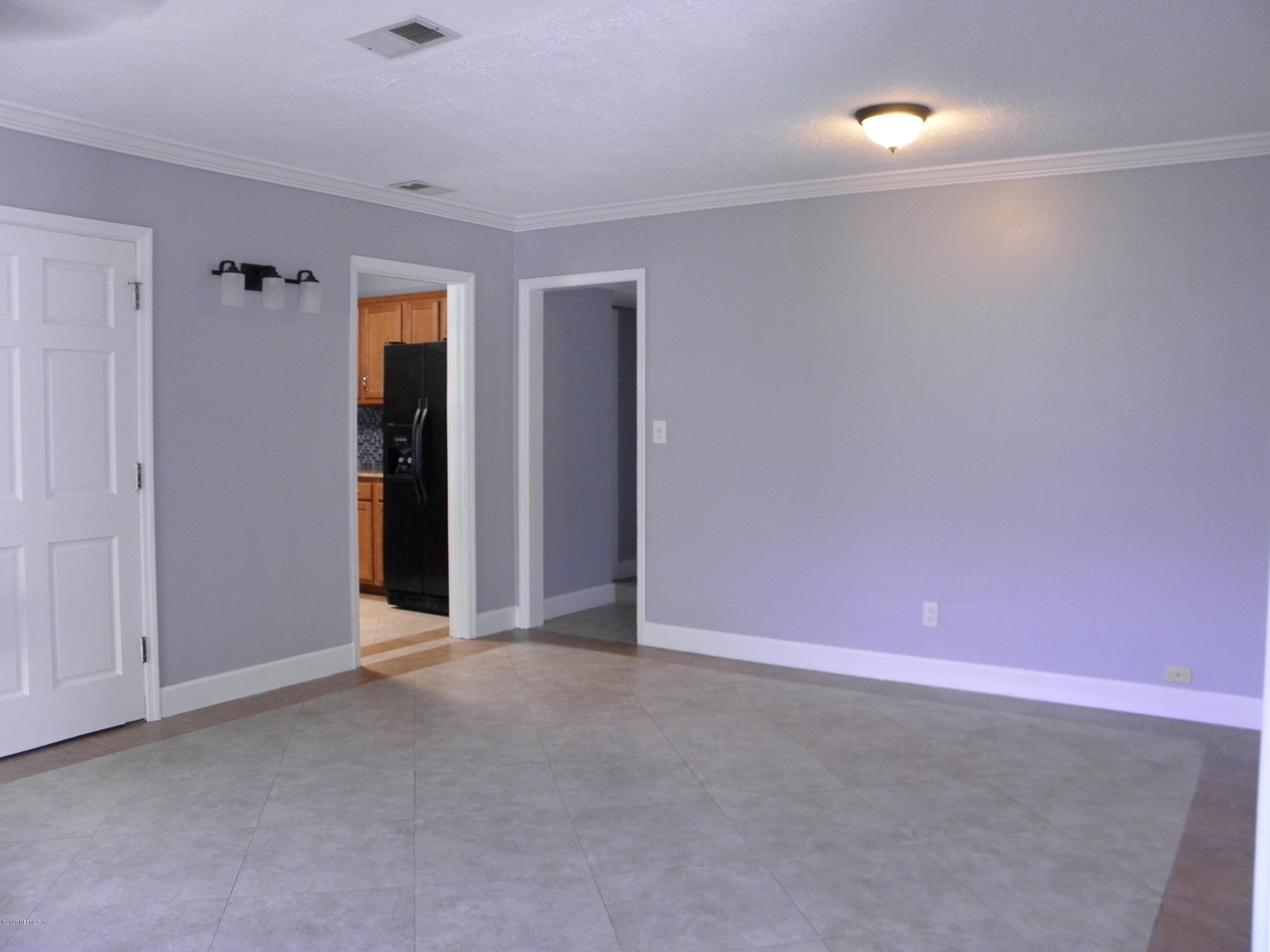 2544 Sam Road Jacksonville, FL 32216 - Photo 5 of 39 an empty room with closet and bathroom