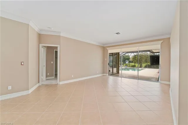 a view of an empty room with glass door