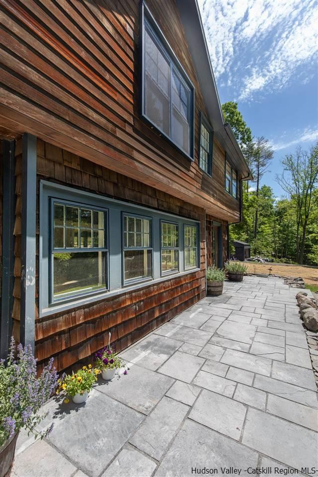 324 Upper Byrdcliffe Road Woodstock, NY 12498 - Photo 11 of 34 a view of a house with brick walls