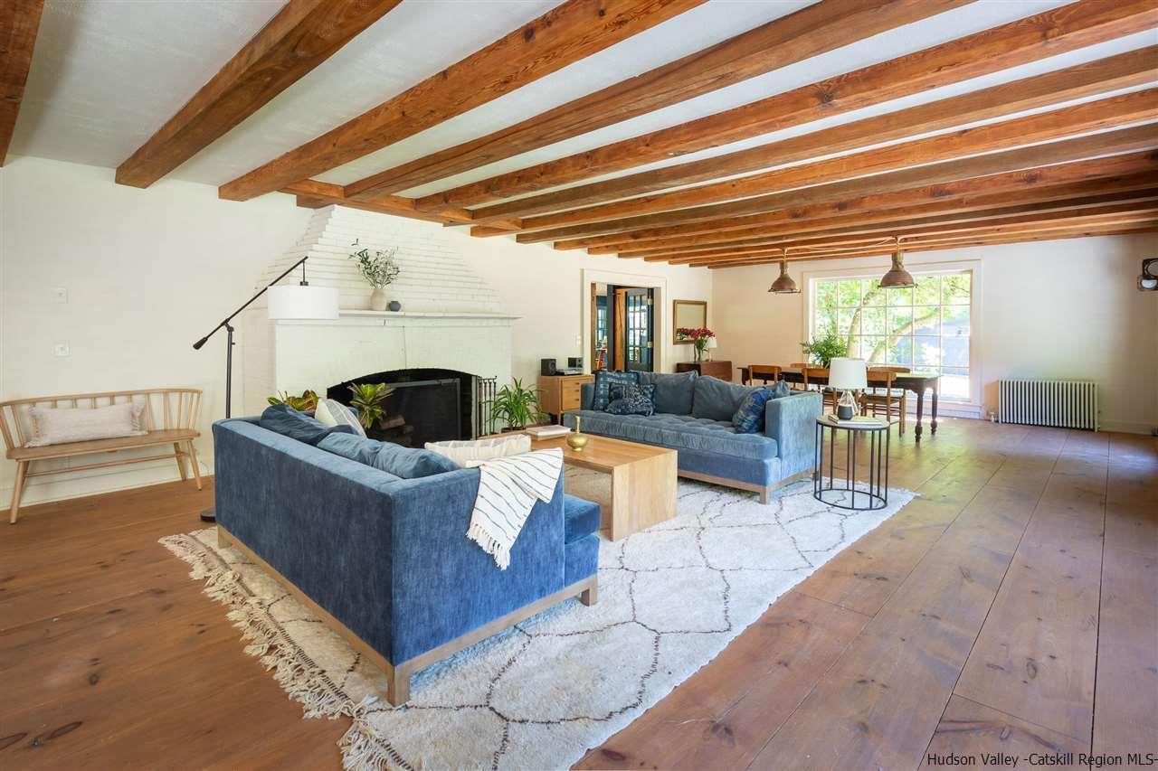 324 Upper Byrdcliffe Road Woodstock, NY 12498 - Photo 17 of 34 a living room with furniture and a large window