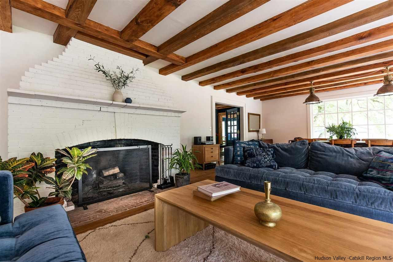 324 Upper Byrdcliffe Road Woodstock, NY 12498 - Photo 19 of 34 a living room with furniture and a fireplace