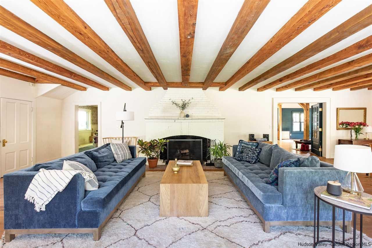 324 Upper Byrdcliffe Road Woodstock, NY 12498 - Photo 20 of 34 a living room with furniture and a fireplace