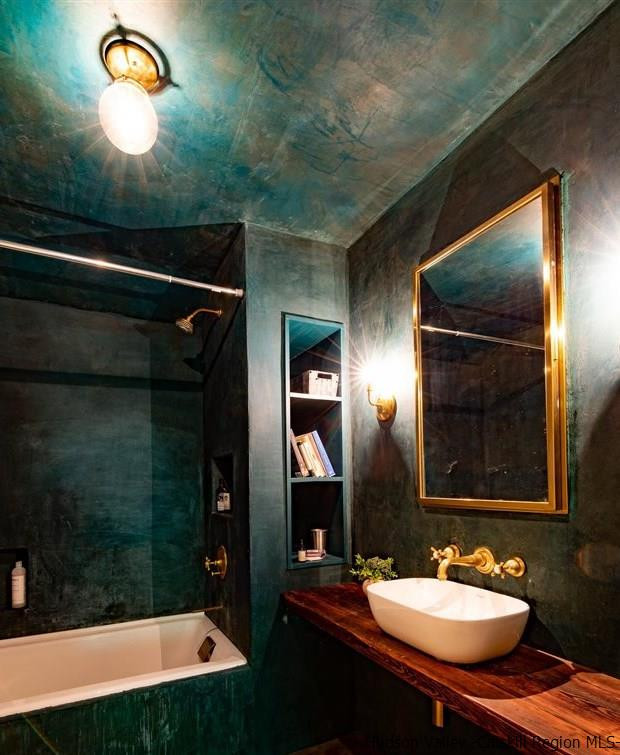 324 Upper Byrdcliffe Road Woodstock, NY 12498 - Photo 27 of 34 a bathroom with a sink a mirror and shower