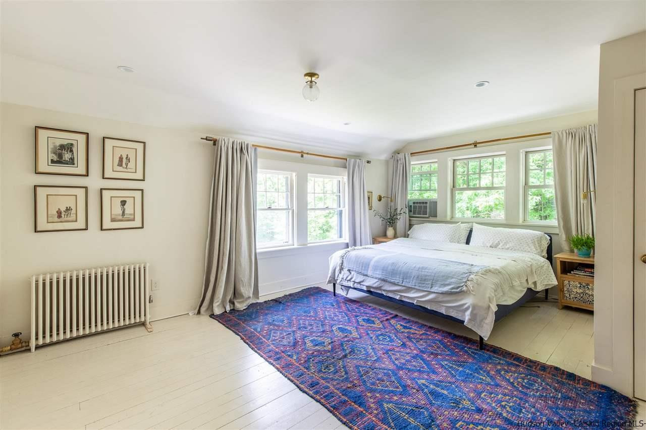 324 Upper Byrdcliffe Road Woodstock, NY 12498 - Photo 28 of 34 a bedroom with a large bed and a window