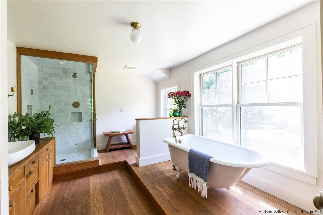 324 Upper Byrdcliffe Road Woodstock, NY 12498 - Photo 29 of 34 a living room with furniture and a large window