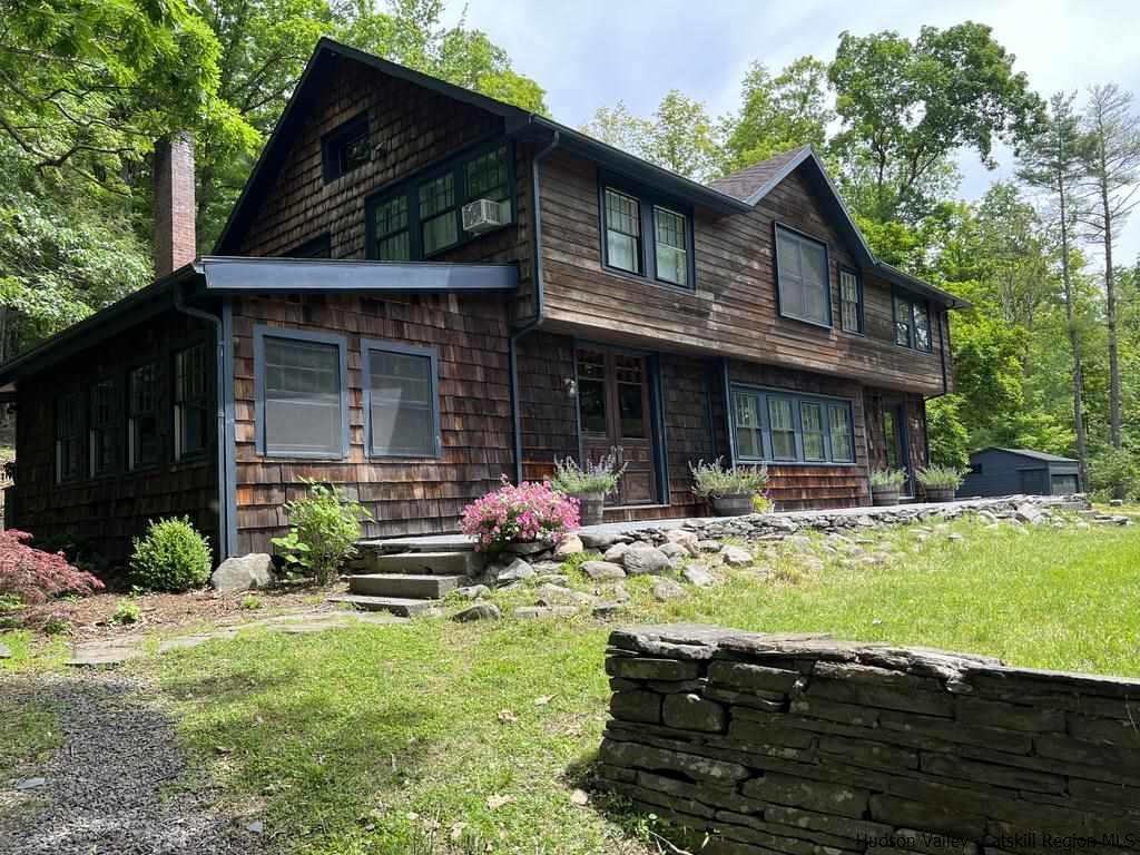 324 Upper Byrdcliffe Road Woodstock, NY 12498 - Photo 3 of 34 a view of a house with backyard tub and sitting area