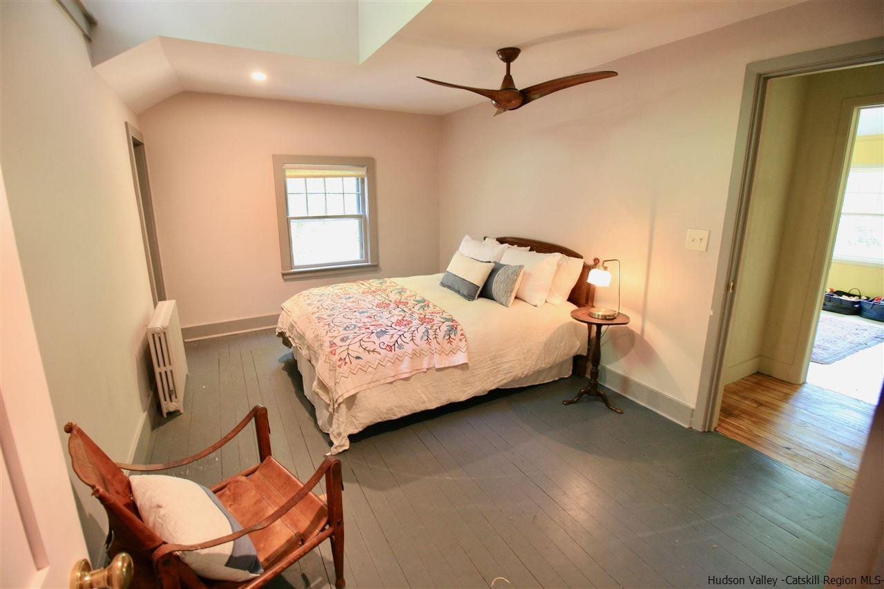 324 Upper Byrdcliffe Road Woodstock, NY 12498 - Photo 31 of 34 a bedroom with a bed and a window