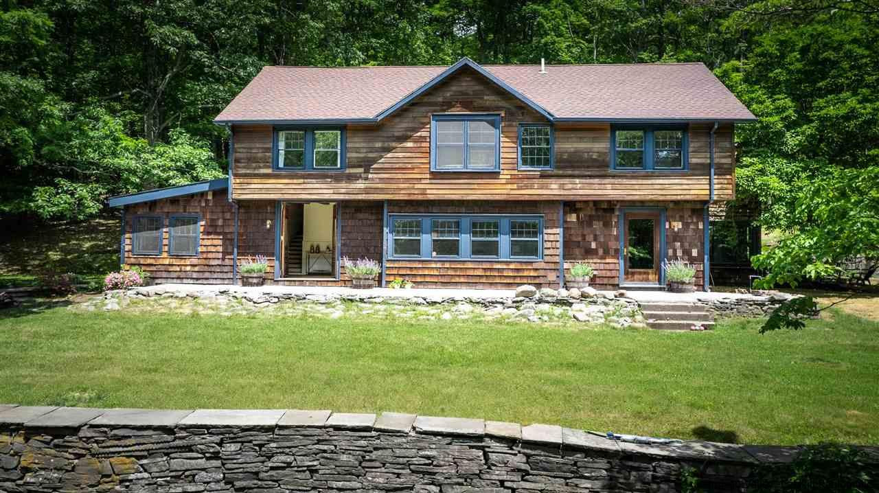324 Upper Byrdcliffe Road Woodstock, NY 12498 - Photo 34 of 34 a front view of a house with swimming pool having outdoor seating