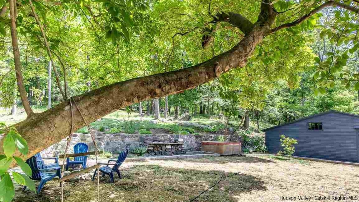 324 Upper Byrdcliffe Road Woodstock, NY 12498 - Photo 8 of 34 a backyard of a house with seating space