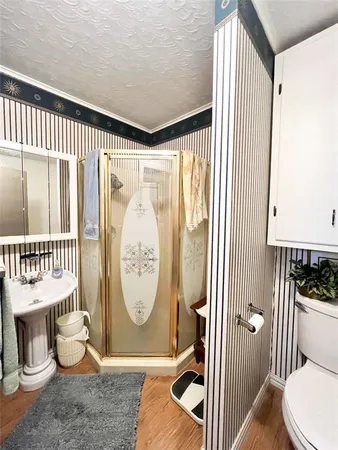 a view of a hallway with dining room and wooden floor