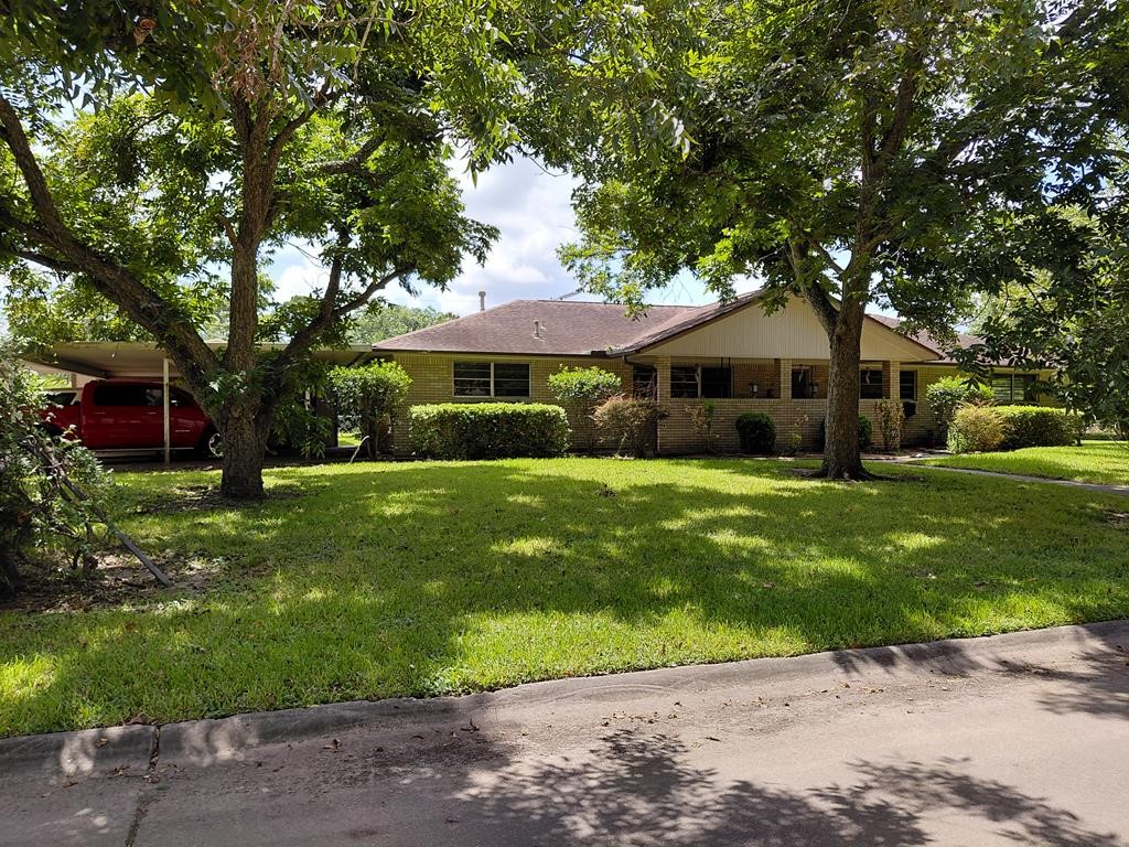 736 Northridge Street Angleton, TX 77515 - Photo 1 of 24 a front view of a house with a garden