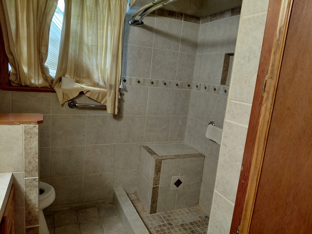 736 Northridge Street Angleton, TX 77515 - Photo 14 of 24 a bathroom with a shower