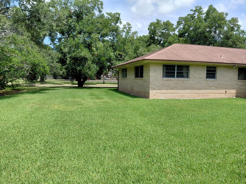 736 Northridge Street Angleton, TX 77515 - Photo 7 of 24 a front view of a house with a yard