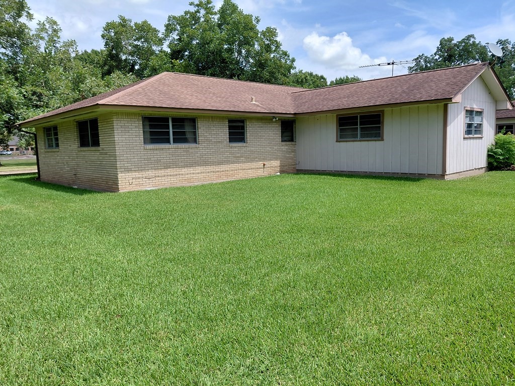 736 Northridge Street Angleton, TX 77515 - Photo 8 of 24 a front view of a house with a garden