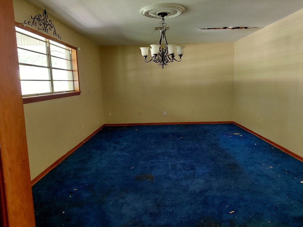 736 Northridge Street Angleton, TX 77515 - Photo 10 of 24 a view of a room with a window and a ceiling fan