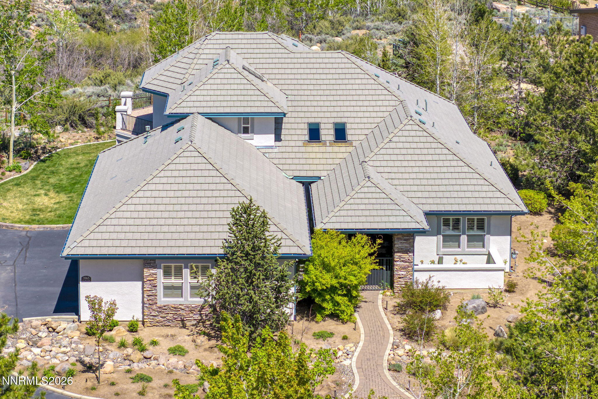 3965 Lake Placid Drive Reno, NV 89511 - Photo 11 of 70 a front view of a house with garden