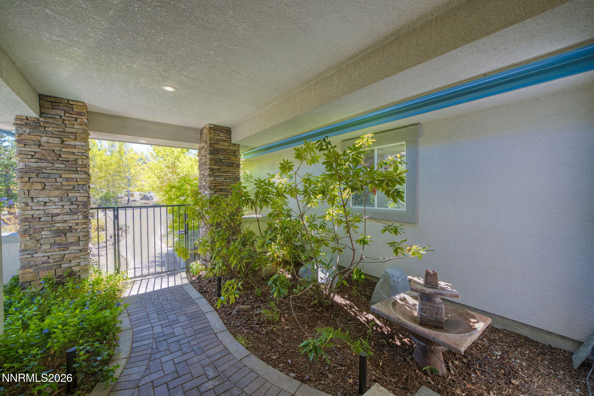 3965 Lake Placid Drive Reno, NV 89511 - Photo 14 of 70 a room with swing chair and potted plants