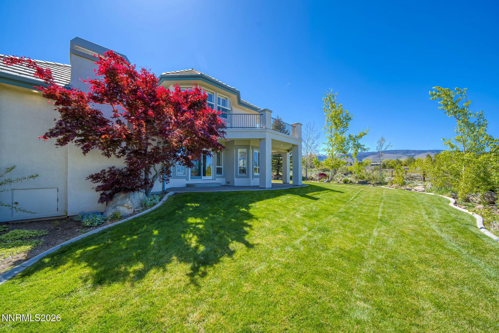 3965 Lake Placid Drive Reno, NV 89511 - Photo 17 of 70 a front view of a house with garden