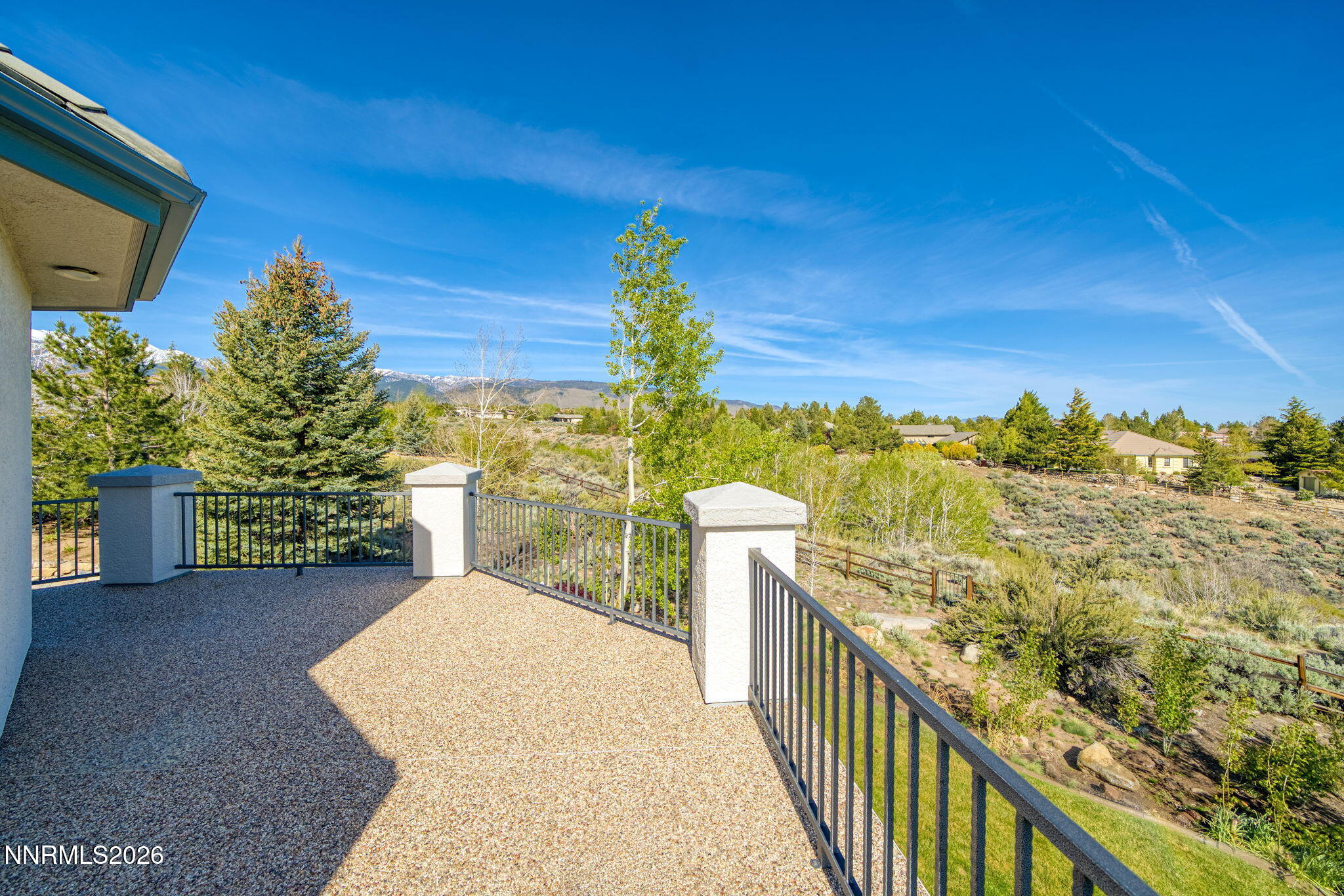 3965 Lake Placid Drive Reno, NV 89511 - Photo 21 of 70 a view of a balcony with chair and wooden fence