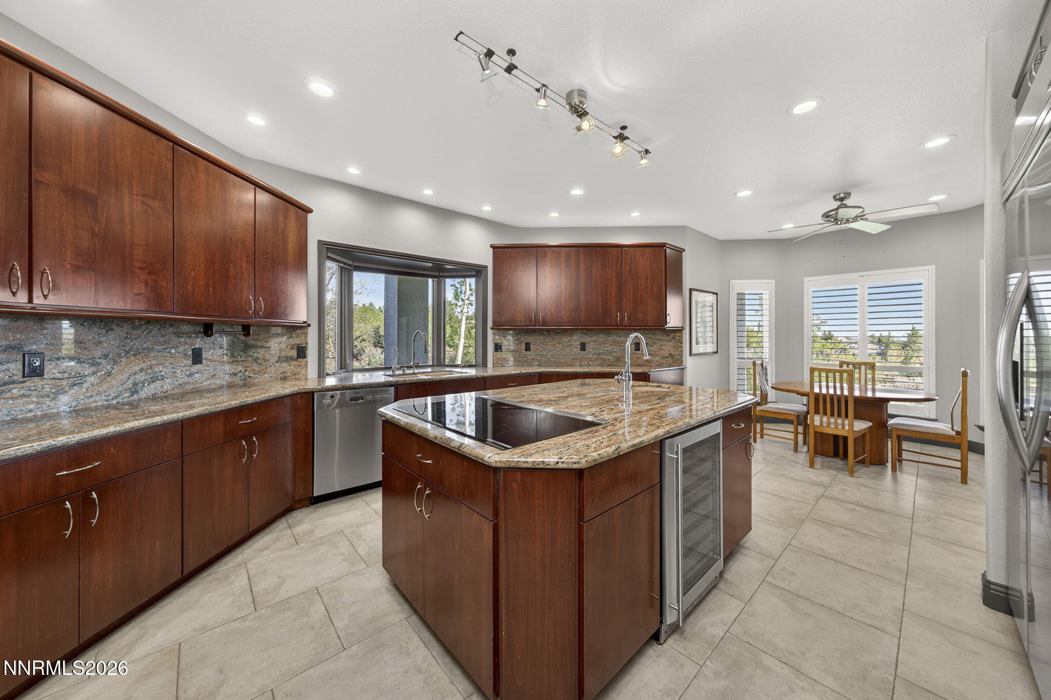 3965 Lake Placid Drive Reno, NV 89511 - Photo 32 of 70 a kitchen with a stove sink cabinets and chairs