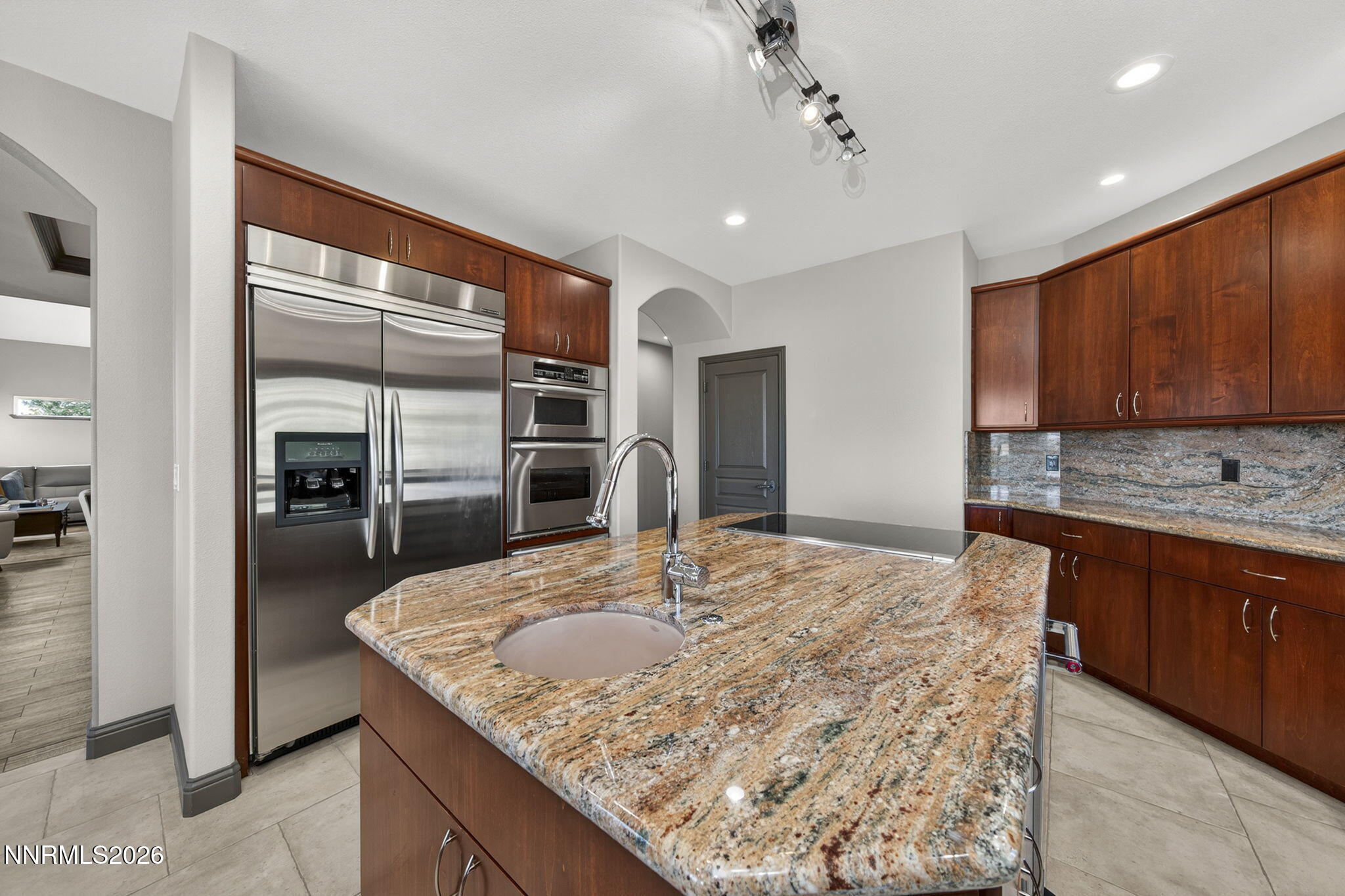 3965 Lake Placid Drive Reno, NV 89511 - Photo 34 of 70 a kitchen with kitchen island a counter top space appliances and a counter space