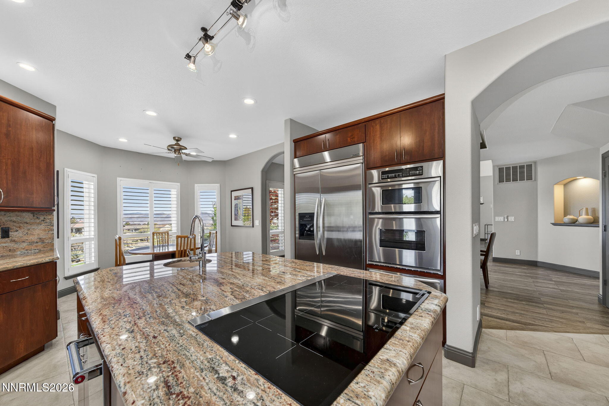 3965 Lake Placid Drive Reno, NV 89511 - Photo 35 of 70 a kitchen with stainless steel appliances granite countertop a sink counter space and cabinets