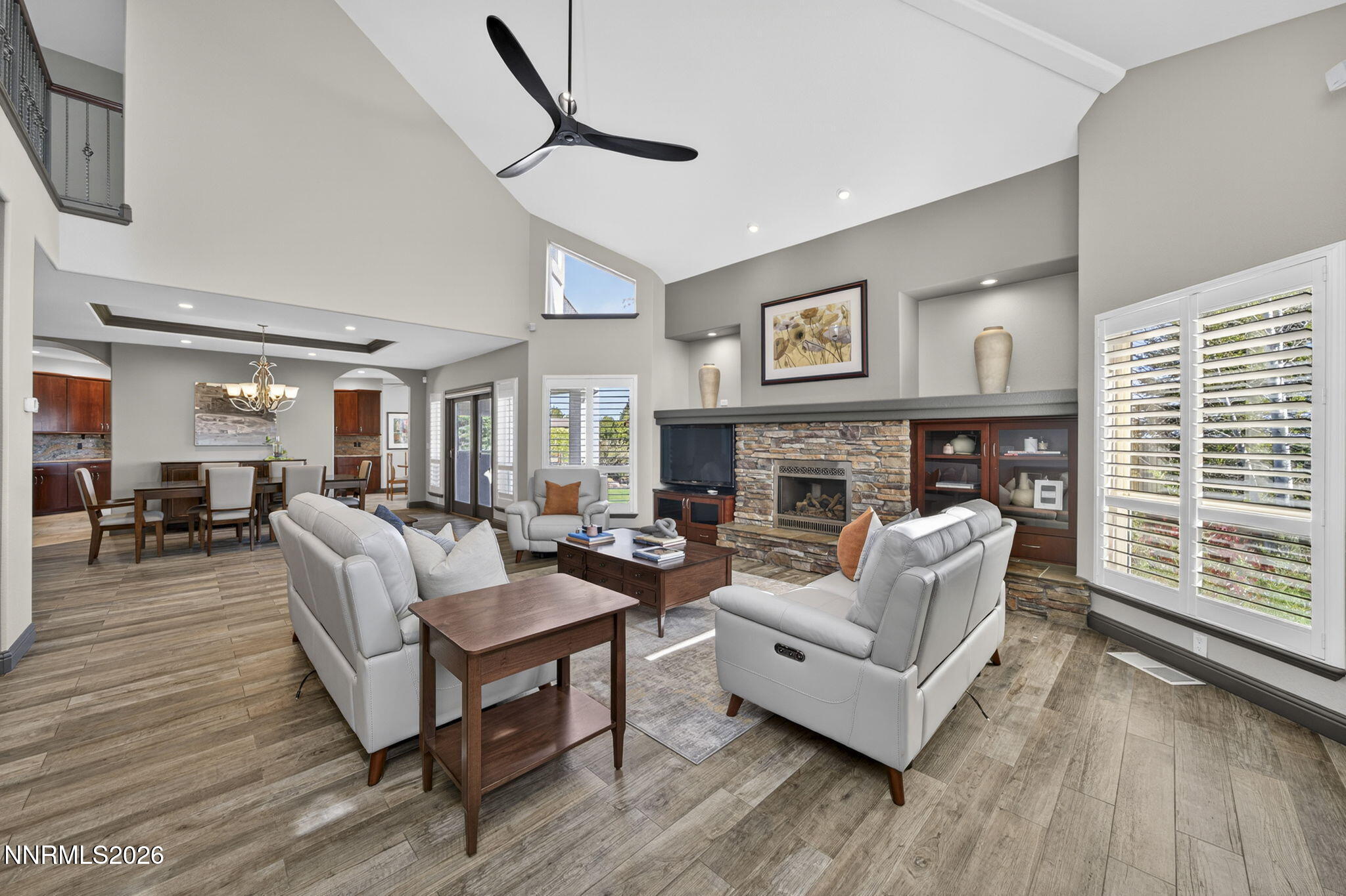 3965 Lake Placid Drive Reno, NV 89511 - Photo 40 of 70 a living room with furniture a large window and a fireplace