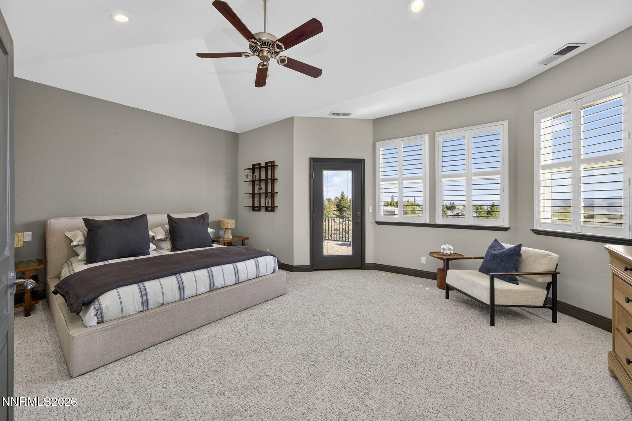 3965 Lake Placid Drive Reno, NV 89511 - Photo 52 of 70 a spacious bedroom with a bed a couch and a window