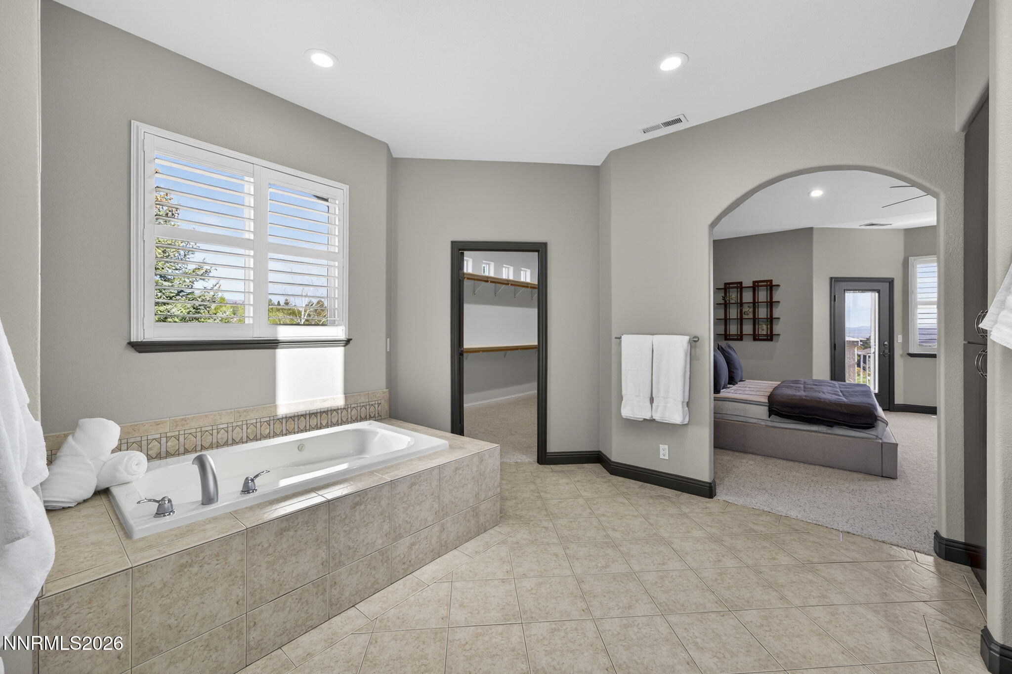3965 Lake Placid Drive Reno, NV 89511 - Photo 57 of 70 a spacious bedroom with a large bed and furniture