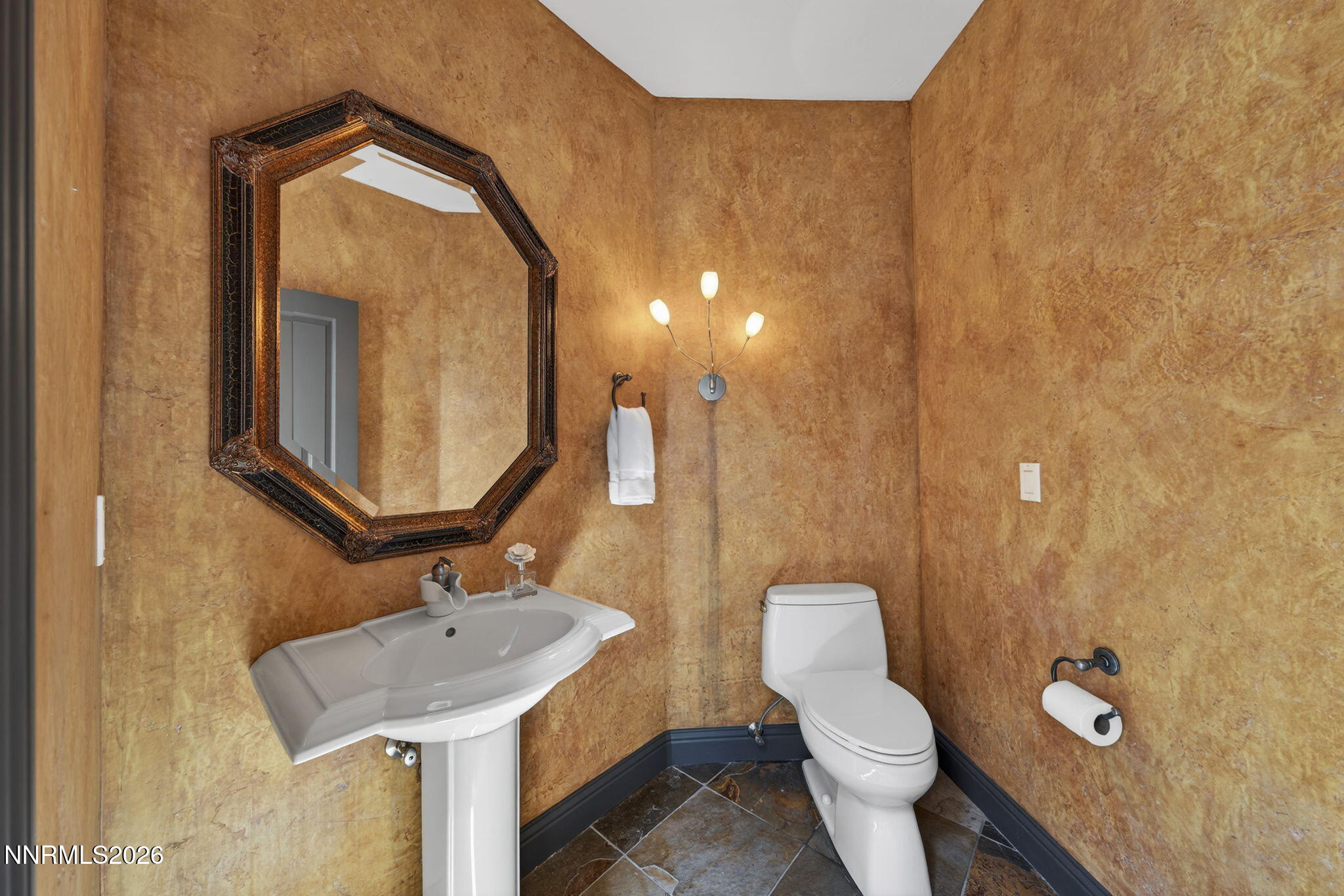 3965 Lake Placid Drive Reno, NV 89511 - Photo 61 of 70 a bathroom with a toilet sink and mirror