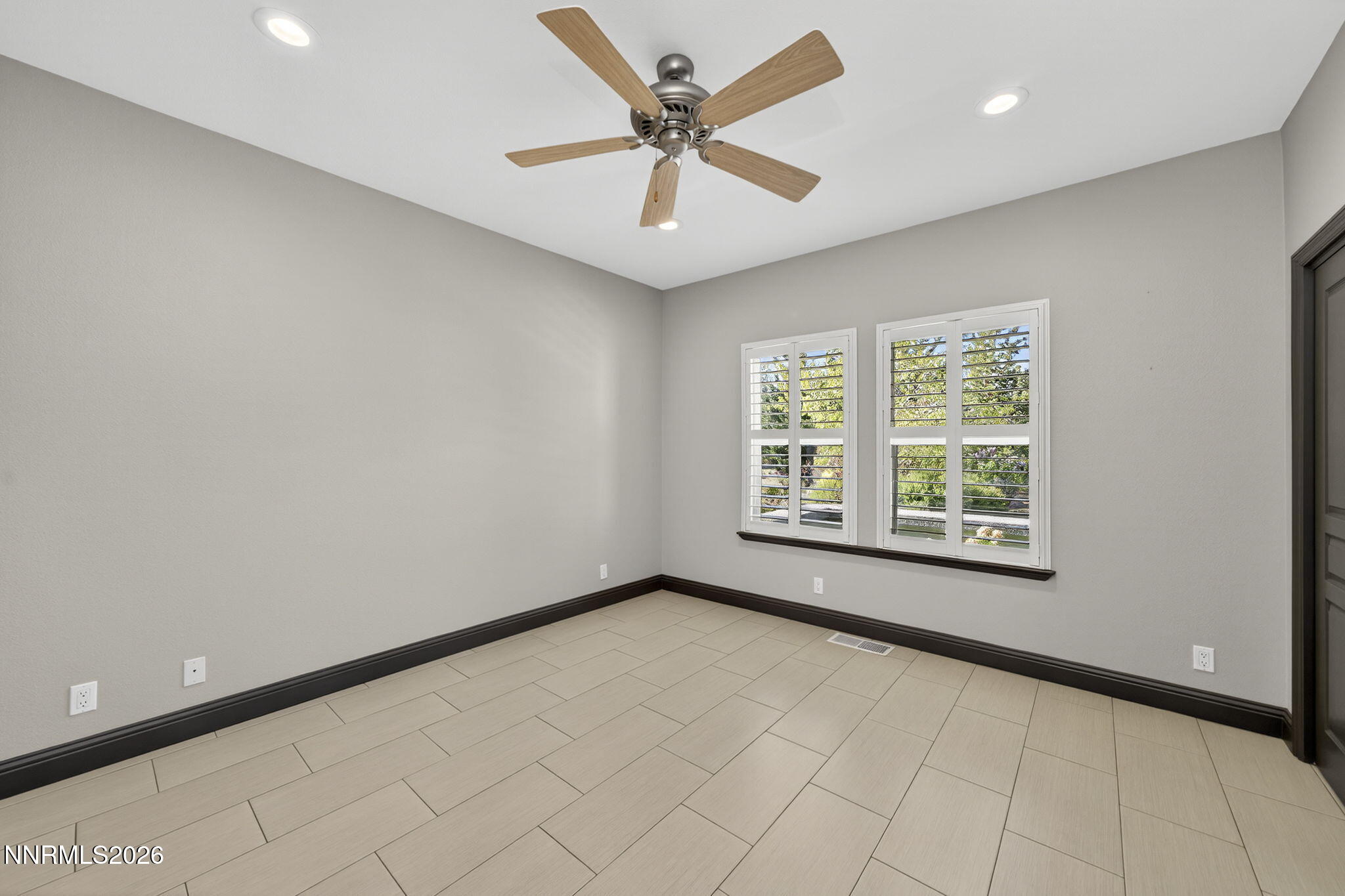3965 Lake Placid Drive Reno, NV 89511 - Photo 68 of 70 an empty room with windows and fan