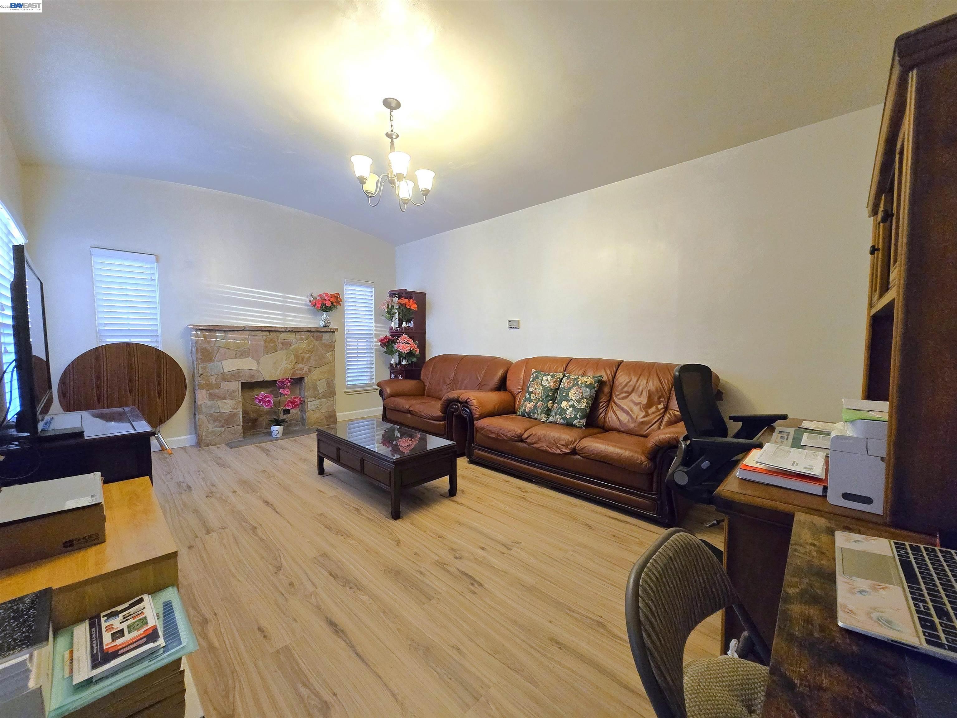 2917 Telegraph Avenue Berkeley, CA 94705 - Photo 5 of 12 a living room with furniture and a fireplace