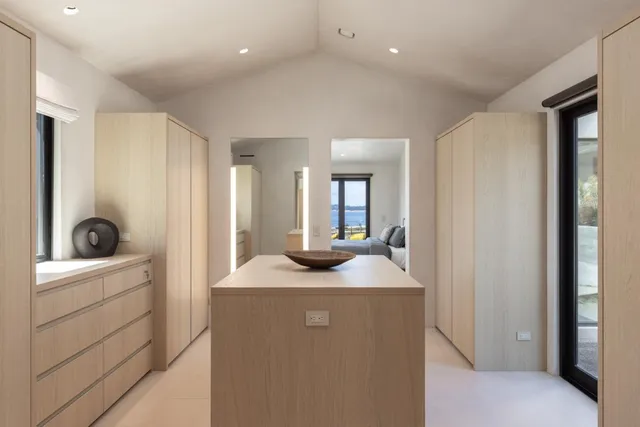 a kitchen with sink refrigerator and faucet